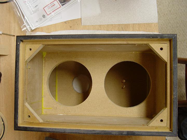 DSC02354.jpg - The inside of the very snazzy Parts express 0.5 cu-ft enclosures.  I can't veneer and finish a set for what these cost.   They use real wood veneer, are nicely braced, have some insanely hard finish on them, and also include nice grilles.  If you want generic box sizes and shapes it's hard to go wrong with these.